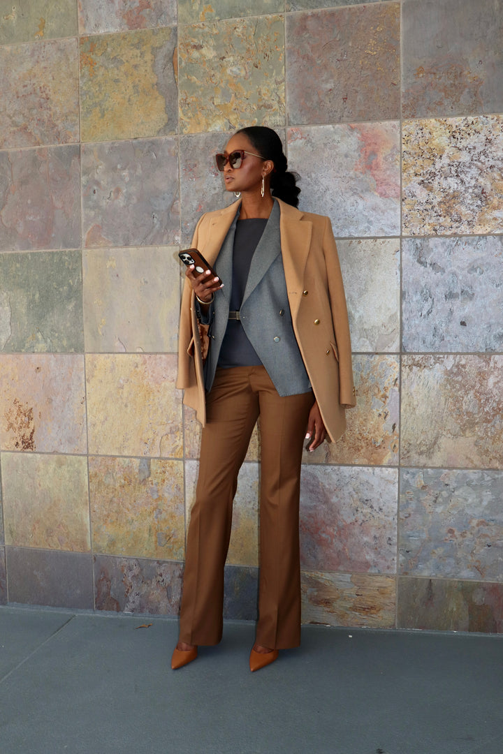 Modern Grey DB Blazer with Cognac Flare Trouser, Charcoal Bateau Neck Top, Gold belt and Camel Carcoat.